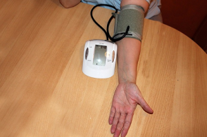 High blood pressure image Man gets blood pressure measured