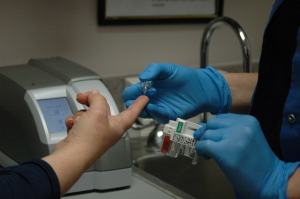 Risk of diabetes with statins use Nurse taking blood for blood sugar test