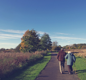 Old couple walking in the lane Old couple in the lane