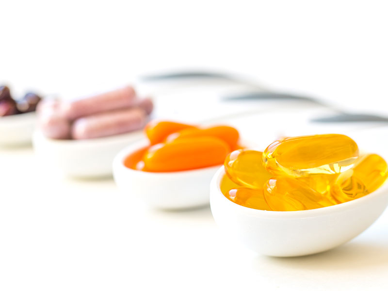 Four small bowls each containing a CoQ10 supplement. But beware because not all CoQ10 products contain the active ingredient even if it says so on the label.