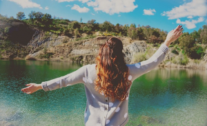 Woman in front of water