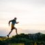 Man running up a mountain at the crack of dawn. He supplements his energy levels daily with CoQ10 which also works as an antioxidant.