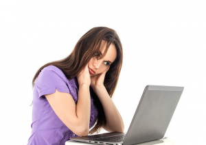 Tired woman at computer