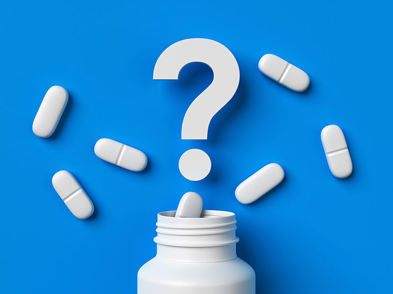 Bright blue background with white tablets and a pill bottle. A large question mark illustrates how documented positive effects of ubiquinone are falsely applied to ubiquinol products.