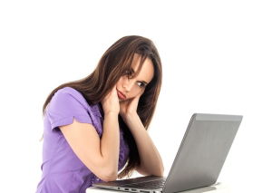 Low energy woman at laptop